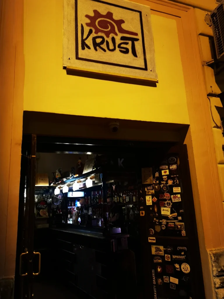 This image displays krust pub palermo, sicily entrance.

In article about the best rock bars, pubs and clubs in Palermo, Sicily, including reviews of Palermo nightlife and best bars for music lovers in Palermo.