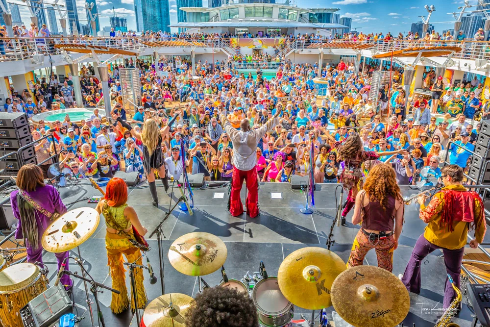 This image displays a band and crowd at a rock cruise.