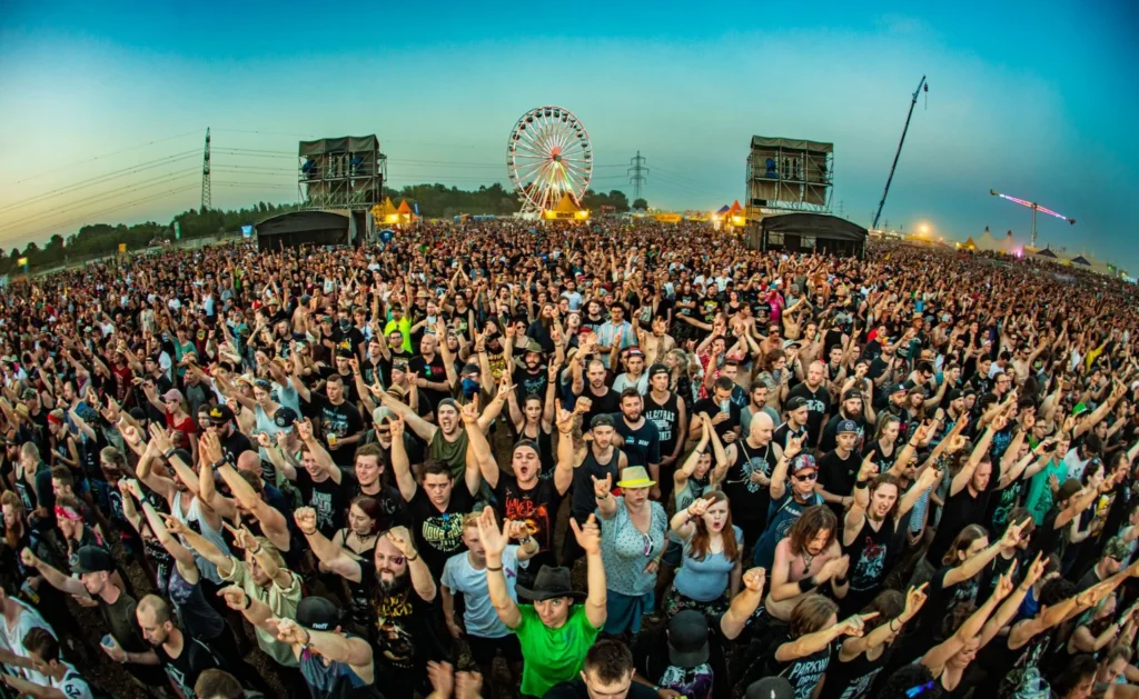 This image displays people at Nova Rock festival.

In article about the best tips to enjoy a metal festival alone and how to find like-minded company and friends at a festival.