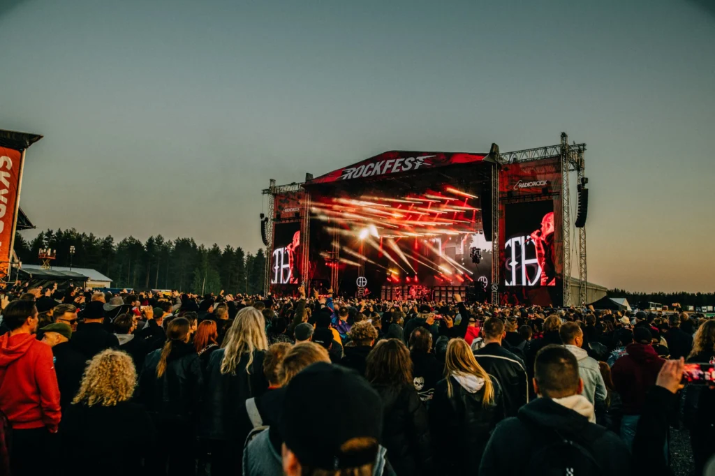 This image displays people at Rockfest festival.

In article about the best tips to enjoy a metal festival alone and how to find like-minded company and friends at a festival.