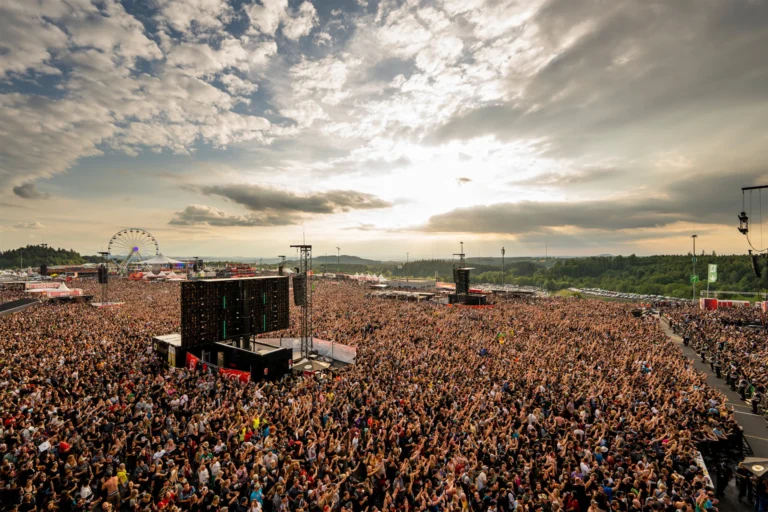 This image displays people at rock am ring festival. in article: must-have items for attending festivals. music festival packing list 101.