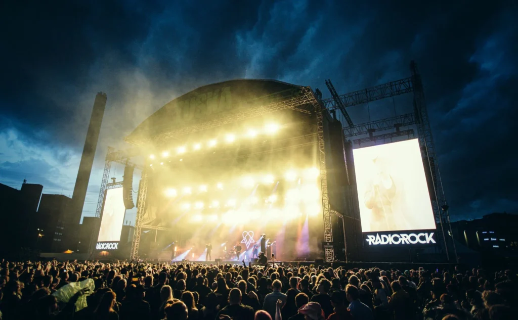 This image displays stage and people at tuska festival, helsinki, finland.

in article: best rock and metal festivals in finland. best rock and metal festivals europe 2024.